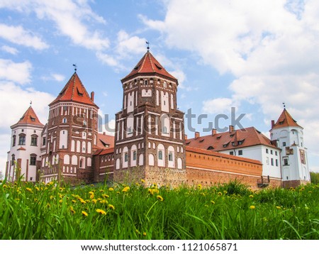 Mir, Belarus. Castle Complex Mir On Sunny Day with blue sky Background. Old medieval Towers and walls of traditional fort from unesco world heritage list