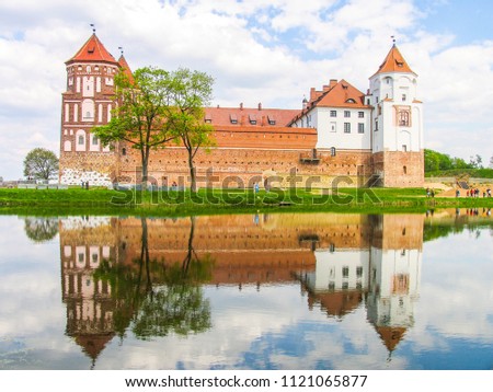 Mir, Belarus. Castle Complex Mir On Sunny Day with blue sky Background. Old medieval Towers and walls of traditional fort from unesco world heritage list
