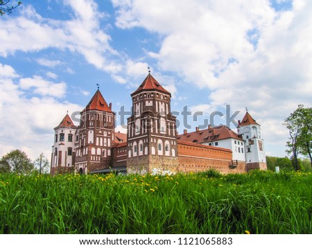 Mir, Belarus. Castle Complex Mir On Sunny Day with blue sky Background. Old medieval Towers and walls of traditional fort from unesco world heritage list