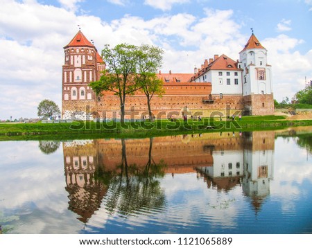 Mir, Belarus. Castle Complex Mir On Sunny Day with blue sky Background. Old medieval Towers and walls of traditional fort from unesco world heritage list