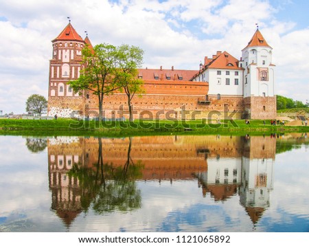 Mir, Belarus. Castle Complex Mir On Sunny Day with blue sky Background. Old medieval Towers and walls of traditional fort from unesco world heritage list