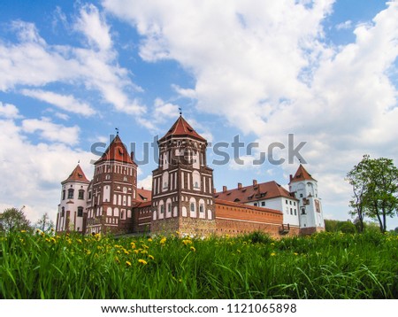 Mir, Belarus. Castle Complex Mir On Sunny Day with blue sky Background. Old medieval Towers and walls of traditional fort from unesco world heritage list