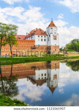 Mir, Belarus. Castle Complex Mir On Sunny Day with blue sky Background. Old medieval Towers and walls of traditional fort from unesco world heritage list
