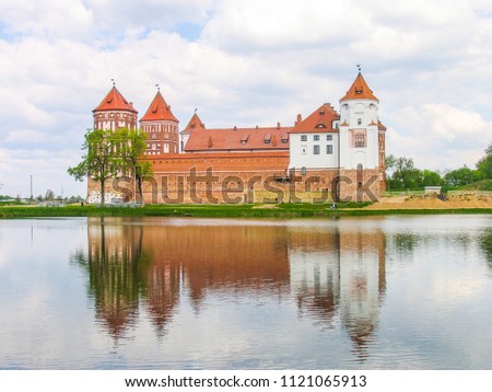Mir, Belarus. Castle Complex Mir On Sunny Day with blue sky Background. Old medieval Towers and walls of traditional fort from unesco world heritage list