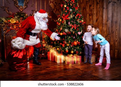 Miracles happen. Small children saw Santa Claus on Christmas eve. Christmas concept.