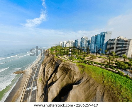 Miraflores, Lima, Peru. Aerial photo of Modern buildings on the top of the green hill next to the Pacific Ocean