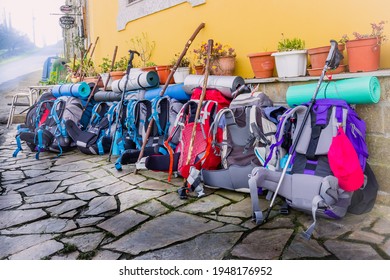 MIRALLOS, SPAIN - MARCH 16, 2016: : Pilgrim Backpacks and Hiking Gear outside Cafe in Morgade, Spain along the Way of St James Pilgrimage Trail Camino de Santiago