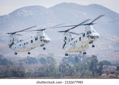 Miramar, USA - 2019: US Army Boeing CH46 Transport Helicopter Formation Landing In The Combat Area Bringing Support Troops