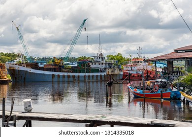 Miri, Sarawak, Malaysia - December 5 2018: Ships DAHA 2 (no IMO Number) And  BIMA SEPULUH (IMO  9616307, Built In 2013) Mooring At Baong River. Seen From Kampong Pulau Melayu