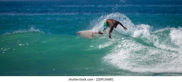 Mirissa, Sri Lanka - 04 07 2022: Sri Lankan Surfer Boy In Action, Cutback On The Wave, And Nearly Lose Control.