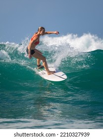 Mirissa, Sri Lanka - 04 09 2022: Professional Surfer Woman In Action, Cut Back The Clear Blue Wave.