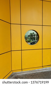the mirror in between the yellow wall
