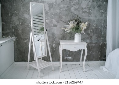 Mirror and boudoir retro table in the interior. High quality photo
