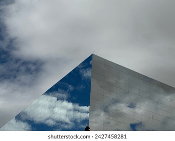 Mirror building with cloudy view