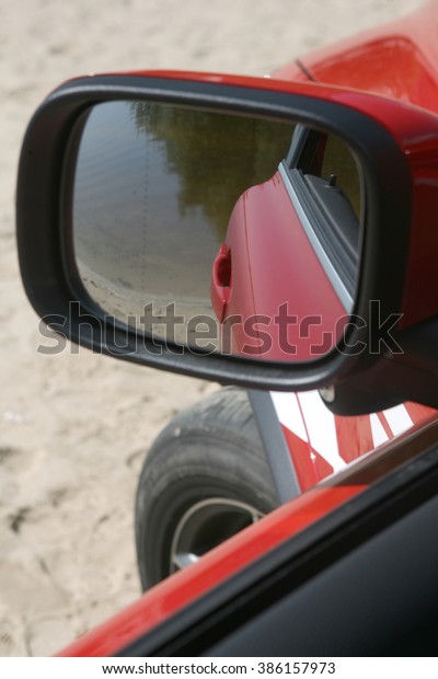 mirror and the camera of\
the red car