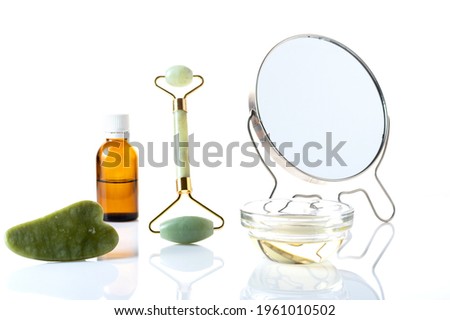 Mirror and cosmetic accessories. Do a facial massage. Body skin care and wore. Isolated.