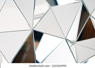 Mirror With Crystals In Wall, Decoration And Reflection. Abstract Glass Background. Polygonal Surface. Close-up. Texture.