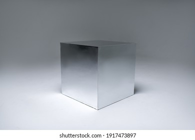 mirror cube on white background. photo studio equipment. White cyclorama.                                
