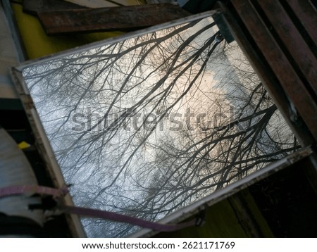 The mirror falling on the ground by the Yangtze River beach in Wuhan City