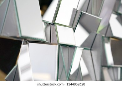 Mirror With Foursquare In Wall, Decoration And Reflection. Abstract Glass Background. Polygonal Surface. Close-up. Texture.