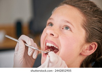 Mirror, hands and dentist with kid for teeth exam, healthcare and orthodontics in clinic. Dental hygiene, child and closeup of medical doctor with tools for patient or pediatrician cleaning mouth - Powered by Shutterstock