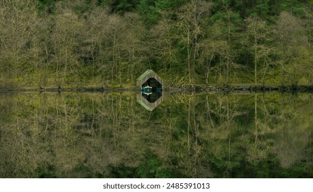 Mirror lake boat house. Loch Ard, Aberfoyle, Scotland. Scottish Highlands. - Powered by Shutterstock