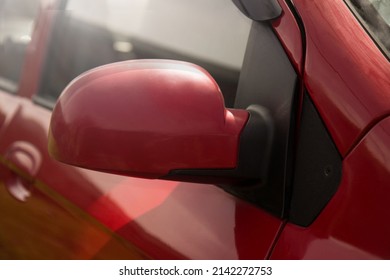 Mirror In A Red Car With A Glare From The Sun