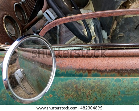 mirror reflection of an old  pickup