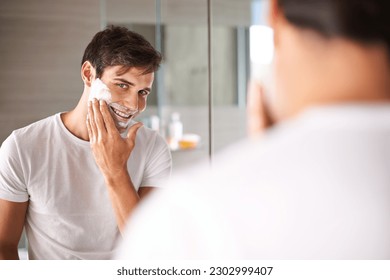 Mirror, shaving and portrait of man in bathroom for facial grooming, wellness and beauty at home. Health, skincare and happy male person with shave foam for face hygiene, cleaning and hair removal - Powered by Shutterstock