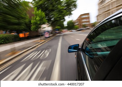 Mirror View Of Speeding Car.