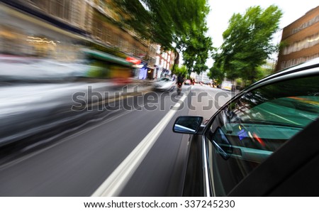 Mirror view of speeding car.