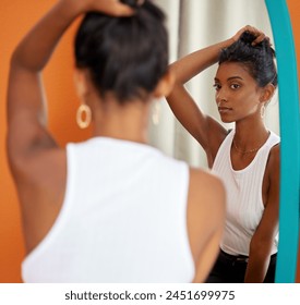 Mirror, woman and shopping for earrings in store, fashion and beauty in boutique at mall. Reflection, retail and customer with jewelry purchase, sales and serious Indian girl thinking of decision - Powered by Shutterstock