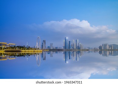 Mirroring scenery of Qianhai CBD in Shenzhen, China during day and night