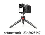 Mirrorless camera on a tripod for live or streaming, mockup camera isolated with clipping path on a white background