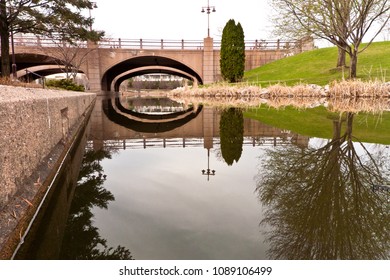 A mirror-like water in the Centennial Lakes Park in Edina, Minnesota