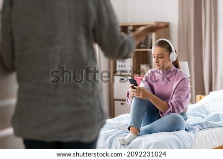 Similar – Image, Stock Photo a child sits on the wooden floor and reads a book while the sun shines on it