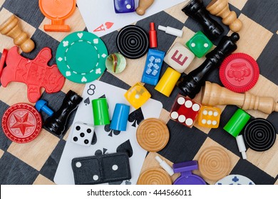 Miscellaneous board game pieces on a chess board