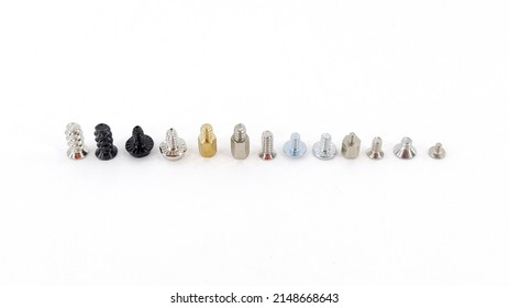 Miscellaneous Cogs and bolts lined up for computer case assembly and PC repair. On an isolated white background.