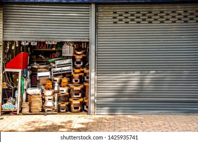 Miscellaneous street shop.Traditional local store front of charcoal burning stove, sell to street cart hawkers. Terracotta stove for grilling, frying, stirring and boiling. Thailand, Asia.
