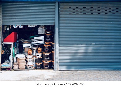 Miscellaneous street shop.Traditional local store front of charcoal burning stove, sell to street cart hawkers. Terracotta stove for grilling, frying, stirring and boiling. Thailand, Asia.