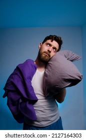 Miserable Man With Blanket And Pillow After Sleepless Night, Looking Up And Standing, Copy Space Above 