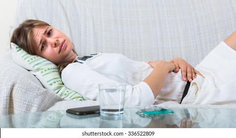 Miserable Young Woman With Early Term Pregnancy Having Miscarriage
