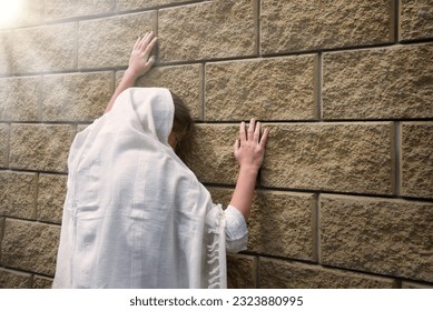 Misery lost bad worry feel mourn grief weep mood young lone holy jew teen lady Mary hand ask god faith hope. Old retro history biblic adult alone human male fail white islam veil templ home text space - Powered by Shutterstock