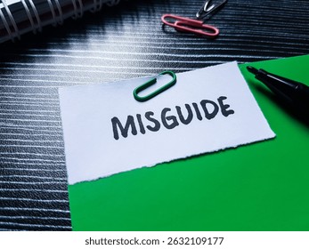 Misguide writting on table background.