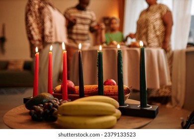 Mishumaa Saba, holder with green, Black and red candles in home where family celebrating Kwanzaa - Powered by Shutterstock