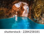 Miskolc, Hungary - 3. june. 2022: Tourists enjoy at the cave with thermal water - natural SPA in Hungary at Miskolc Hungary. Rock tube with thermal water