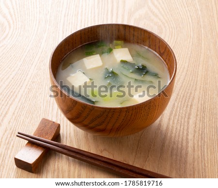 Miso soup with tofu and wakame seaweed on a wooden table ストックフォト © 
