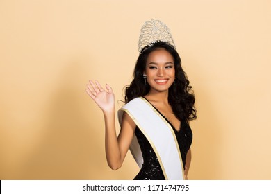 Miss Beauty Pageant Queen Contest in Asian Evening Ball Gown sequin dress with Diamond Crown Sash, fashion make up face eyes love heart hair style, studio lighting beige background isolated copy space - Shutterstock ID 1171474795