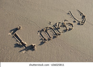 I Miss U Message Written On Sand