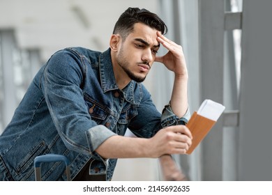 Missed Flight. Pensive Frustrated Arab Man With Passport And Tickets Standing In Airport, Thoughtful Upset Young Middle Eastern Guy Touching Forehead, Having Problems With Travel, Copy Space